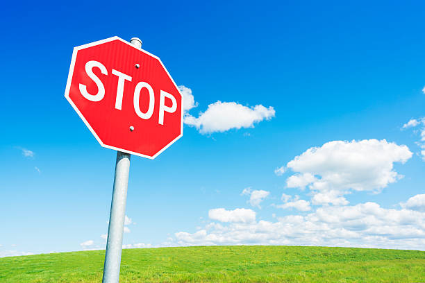 istock Stop road sign against blue sky 490054194
