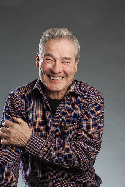 istock Happy - senior portrait series on grey background. 490054338