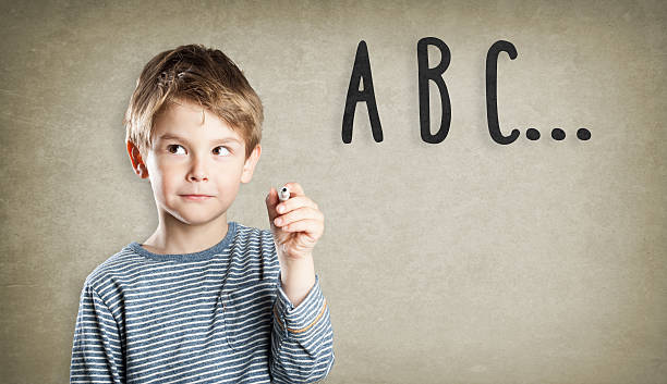 istock Portrait of boy, writing and thinking, learning to write 490054734
