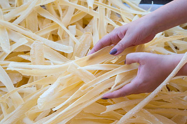 Homemade pasta in woman hands