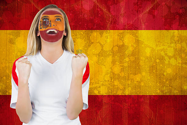 istock Excited spain fan in face paint cheering 490063271