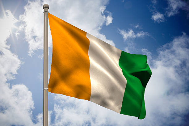 Ivory coast national flag on flagpole