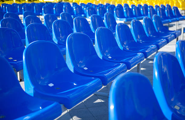 istock Blue and Yellow Plastic Stadium Seats Outdoors 490064225