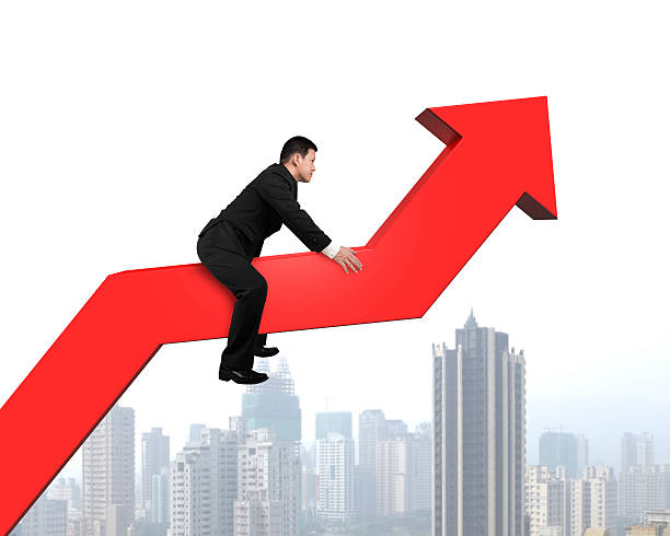 istock Businessman riding on red arrow with city view 490064395