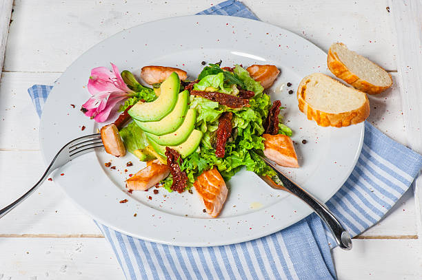 Salad with fried salmon stock photo