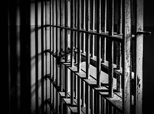 Prison Cell Bars Prison Cell Bars - Black and White prison stock pictures, royalty-free photos & images
