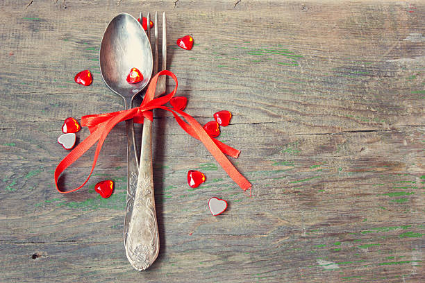 istock old vintage fork and spoon with red ribbon and valentine's hearts 490069319