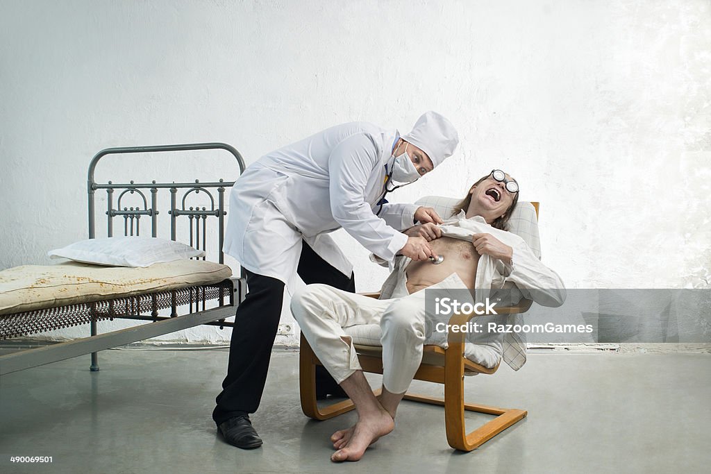 Doctor and patient Doctor and bizarre patient in a hospital Hospital Stock Photo