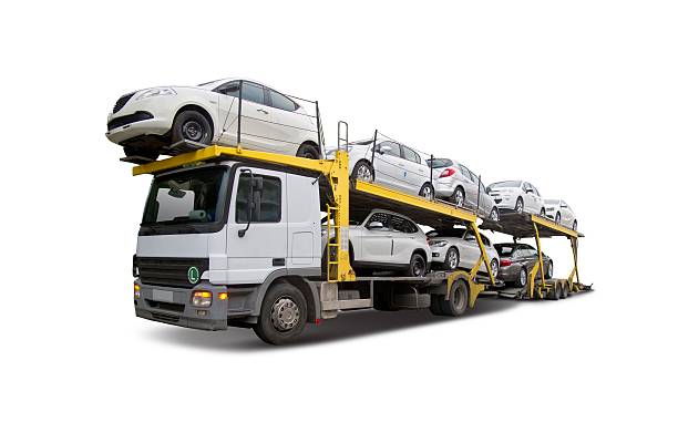 Car carrier Car carrier truck deliver new auto isolated on white car transporter photos stock pictures, royalty-free photos & images