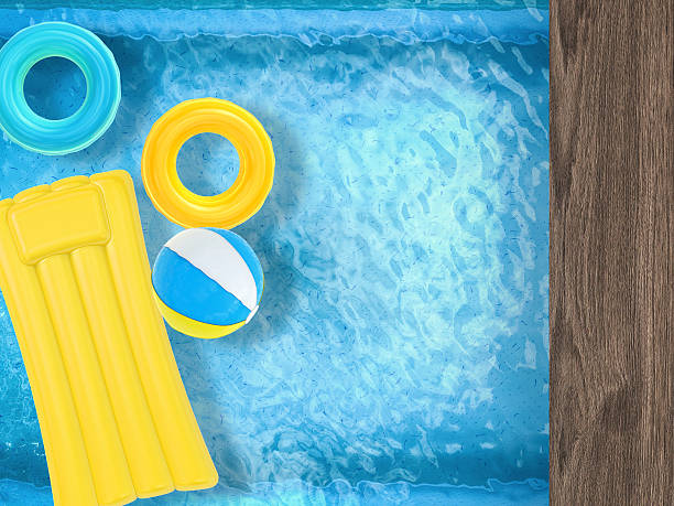 istock summer fun with inflatable toys floating on pool top view 490070160