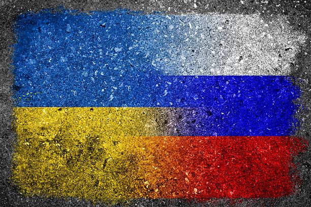 Merged Russian and Ukrainian Flags Painted on Concrete Wall stock photo