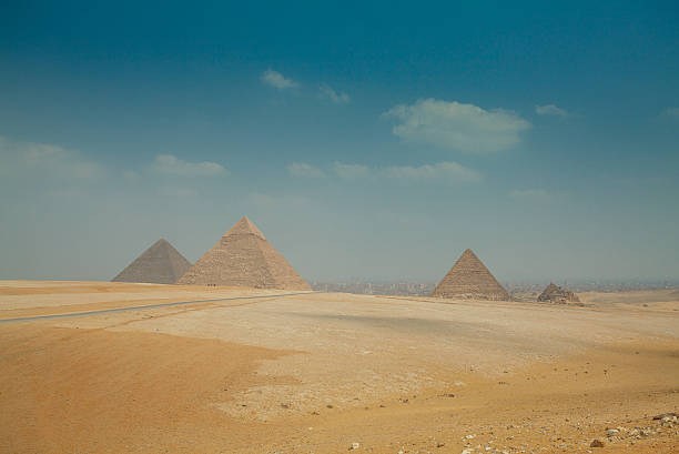 istock egyptian pyramids in heat yellow sands 490072894
