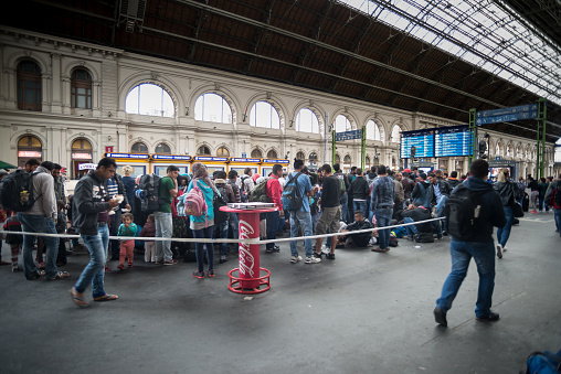 Budapest,Hungary,September 10,2015: Refugees in the Keleti train station structure  of Budapest.All they are looking for a better opportunity to live better, away from poverty and being killed simply for being Catholic. Here in this picture you can see the actual situation in this place.