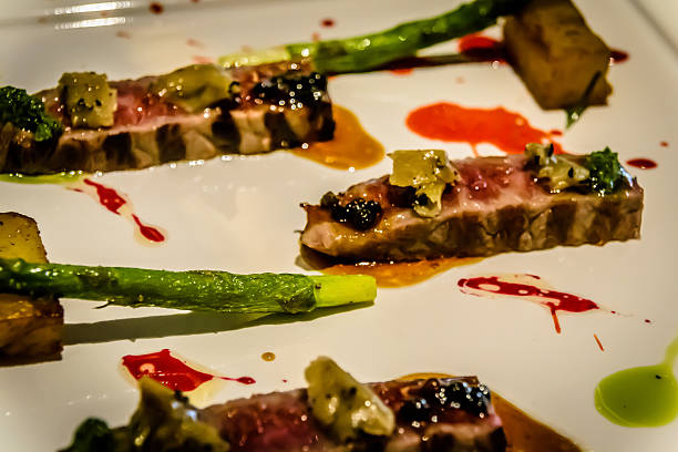 Grilled Blackmore Striploin with Black Truffle, Pepper, Potato and Asparagus Grilled Blackmore Striploin with Black Truffle, Pepper, Potato and Asparagus blackmore vale stock pictures, royalty-free photos & images