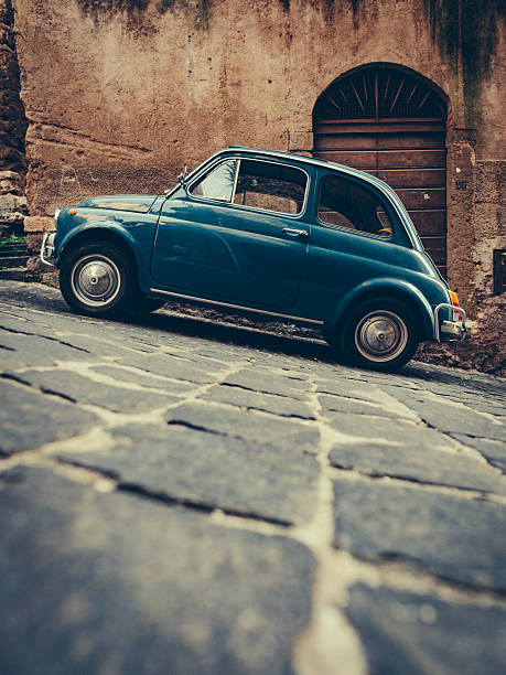 istock Vintage italian blue car on cobbled street 490077350