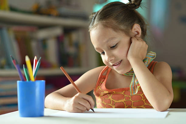 istock Little girl drawing at home 490080768