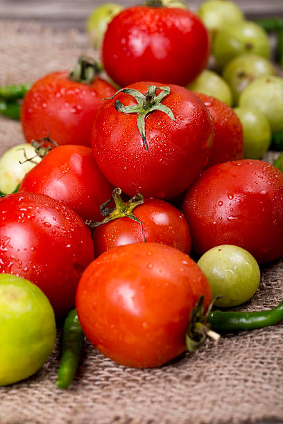 istock Fresh red cherry tomatoes and other vegetables around it 490081150