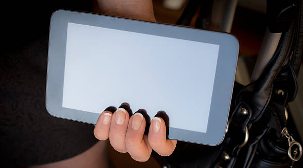 istock Woman holding a digital tablet with one hand 490084712