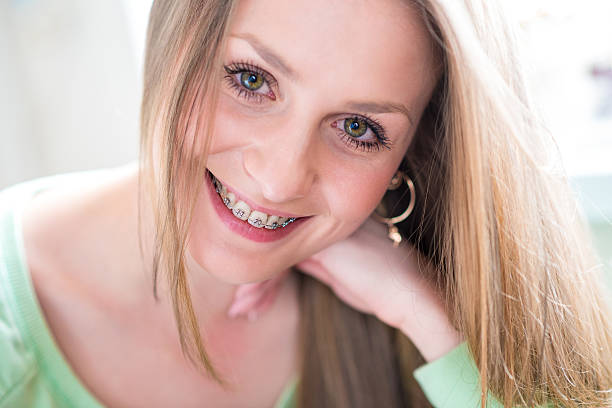 istock happy beautiful girl with braces 490098532