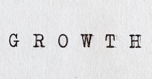 istock Growth written on white paper with old typewriter. 490100668