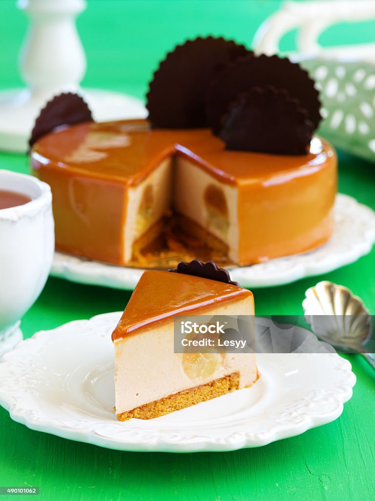 Caramel mousse cake with pears and chocolate. Caramel mousse cake with pears and chocolate.Caramel mousse cake with pears and chocolate. Baked Stock Photo