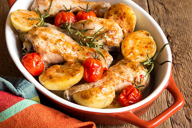 istock Oven baked chicken and vegetables 490102712