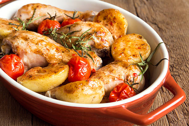 istock Oven baked chicken and vegetables 490102732