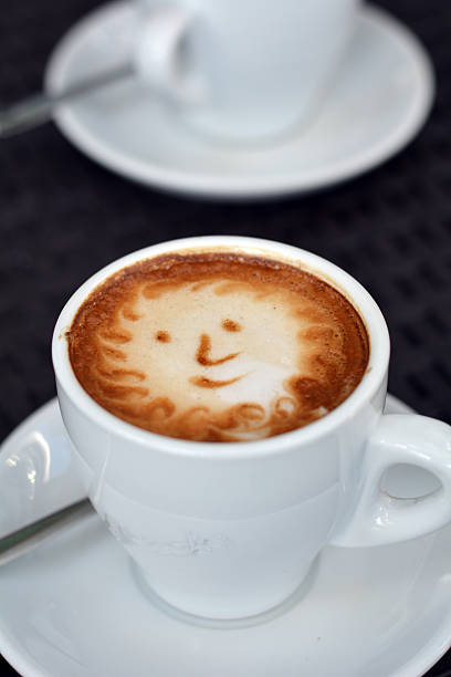 istock Delicious foamy cappuccino on the black background 490103670
