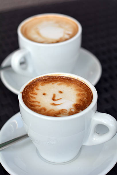 istock Delicious foamy cappuccino on the black background 490103832