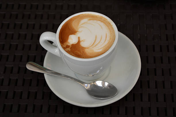 istock Cup Of Foamy Cappuccino On A Black Background 490104574