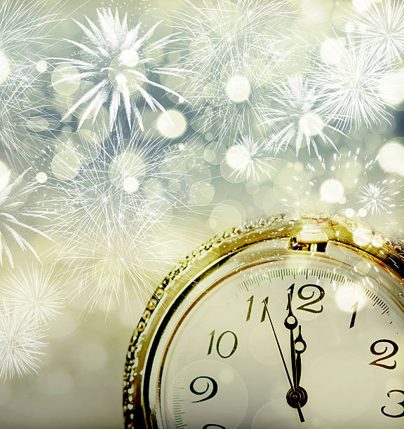 istock Old clock with fireworks and holiday lights 490104888