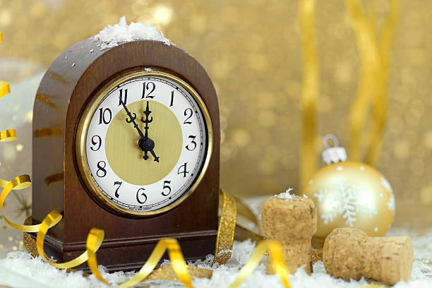 istock Happy New Year. Old clock on yellow abstract background 490104914