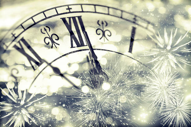 istock Old clock with fireworks and holiday lights 490104984