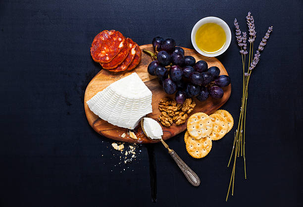 istock appetizer platter. ricotta cheese, crackers, grapes, olive oil, 490106490