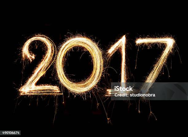 2017 Word Written With Sparkle Firework On Black Background Stock Photo - Download Image Now