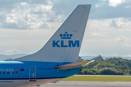 Manchester, United Kingdom - August 07, 2015: KLM Royal Dutch Airlines Boeing 737 tail livery at Manchester Airport.