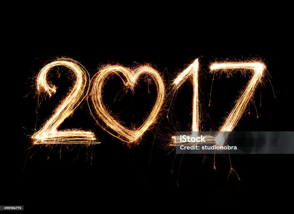 2017 word written with Sparkle firework on black background 2017 Stock Photo