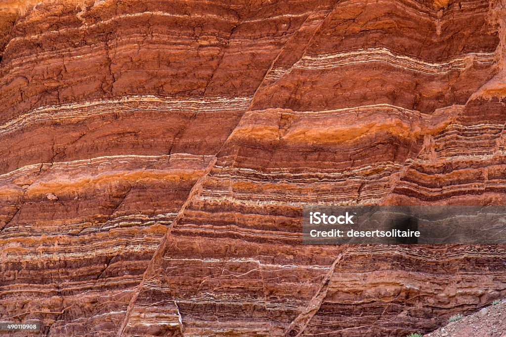 Stone Formation Showing Fault Lines Fault lines and colorful layers in standstone also useful as a background or texture. Geology Stock Photo
