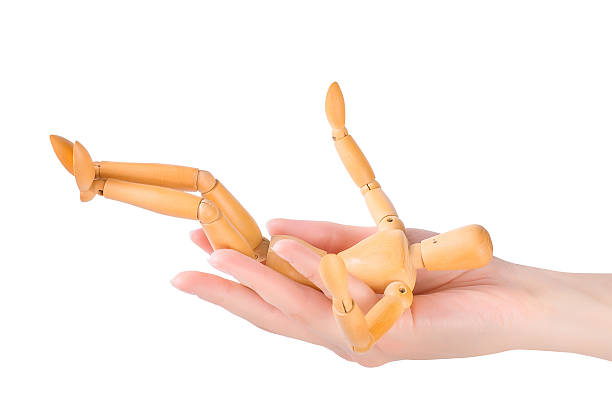 istock wooden dummy falling in woman's hand 490111822