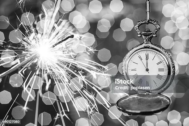 New Year Clock Counting Down And Sparkler Stock Photo - Download Image Now - 12 O'Clock, 2016, Abstract