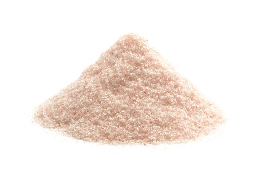 Fine grain pink Himalayan rock salt, isolated on a white background.