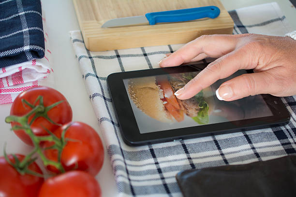 istock woman looking up hamburger recipe online 490127334