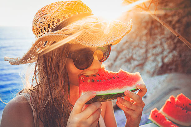 istock Eating and enjoying watermelon 490128382