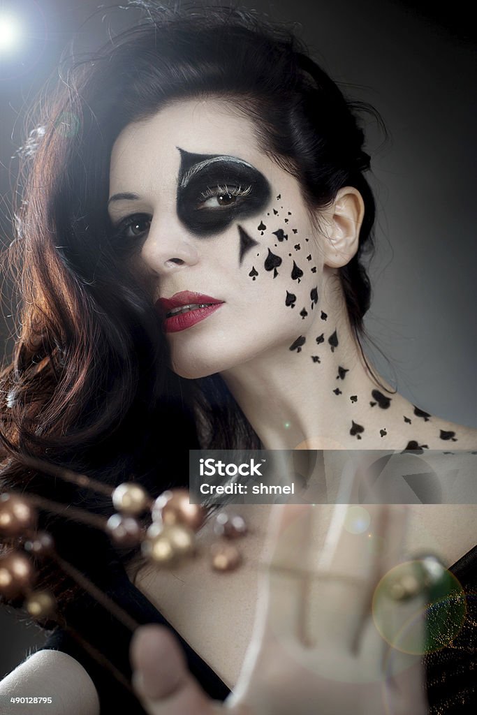 beautiful woman with make-up and body-art styled as playing card Adult Stock Photo