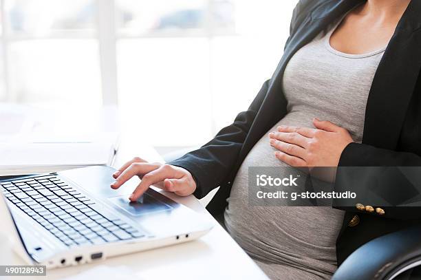 Pregnant Woman Working On Laptop Stock Photo - Download Image Now - Pregnant, Working, Women