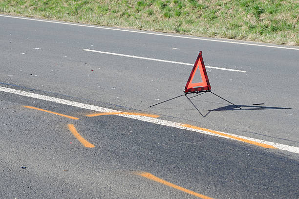 istock Warning triangle on the road after the car crash 490128994
