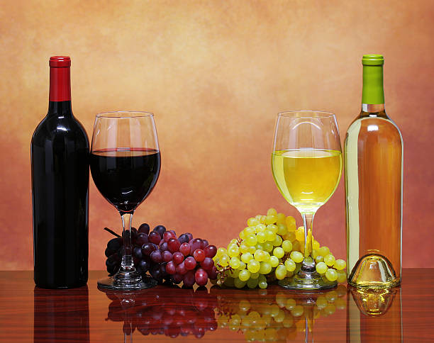 istock Bottles of Red and White Wine with Fresh Grapes 490129209