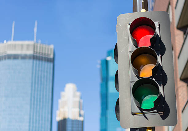 istock Red Traffic Light in City with Buildings in Background 490129816