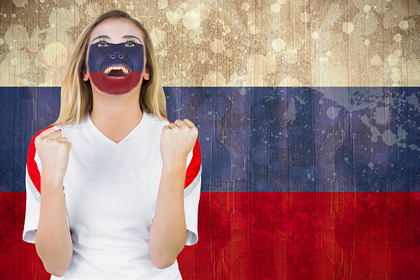 istock Excited russia fan in face paint cheering 490129827