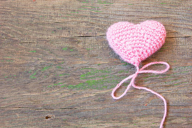 istock pink heart on a cracked old wooden texture 490130207